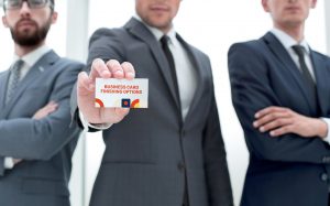 business-team-leader-showing-business-card